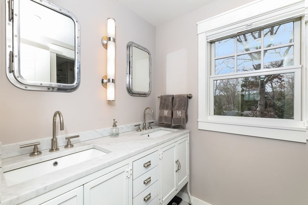 40 Dexter Road Marion, MA 02738 - Photo 18 of 27 a bathroom with a double vanity sink mirror and