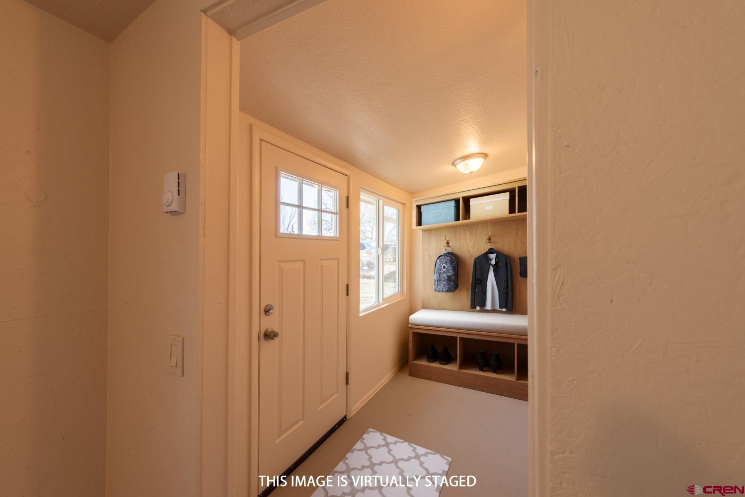 525 Elizabeth Street Delta, CO 81416 - Photo 18 of 30 a view of hallway with washer and dryer