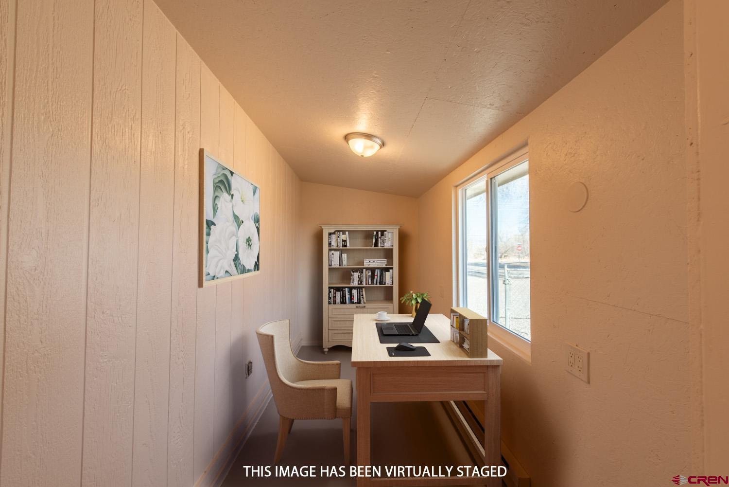 525 Elizabeth Street Delta, CO 81416 - Photo 19 of 30 a view of a workspace with furniture and window