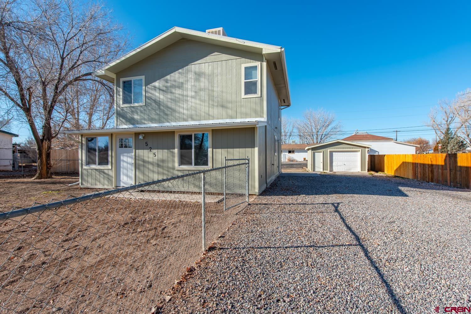 525 Elizabeth Street Delta, CO 81416 - Photo 2 of 30 a front view of a house with a yard
