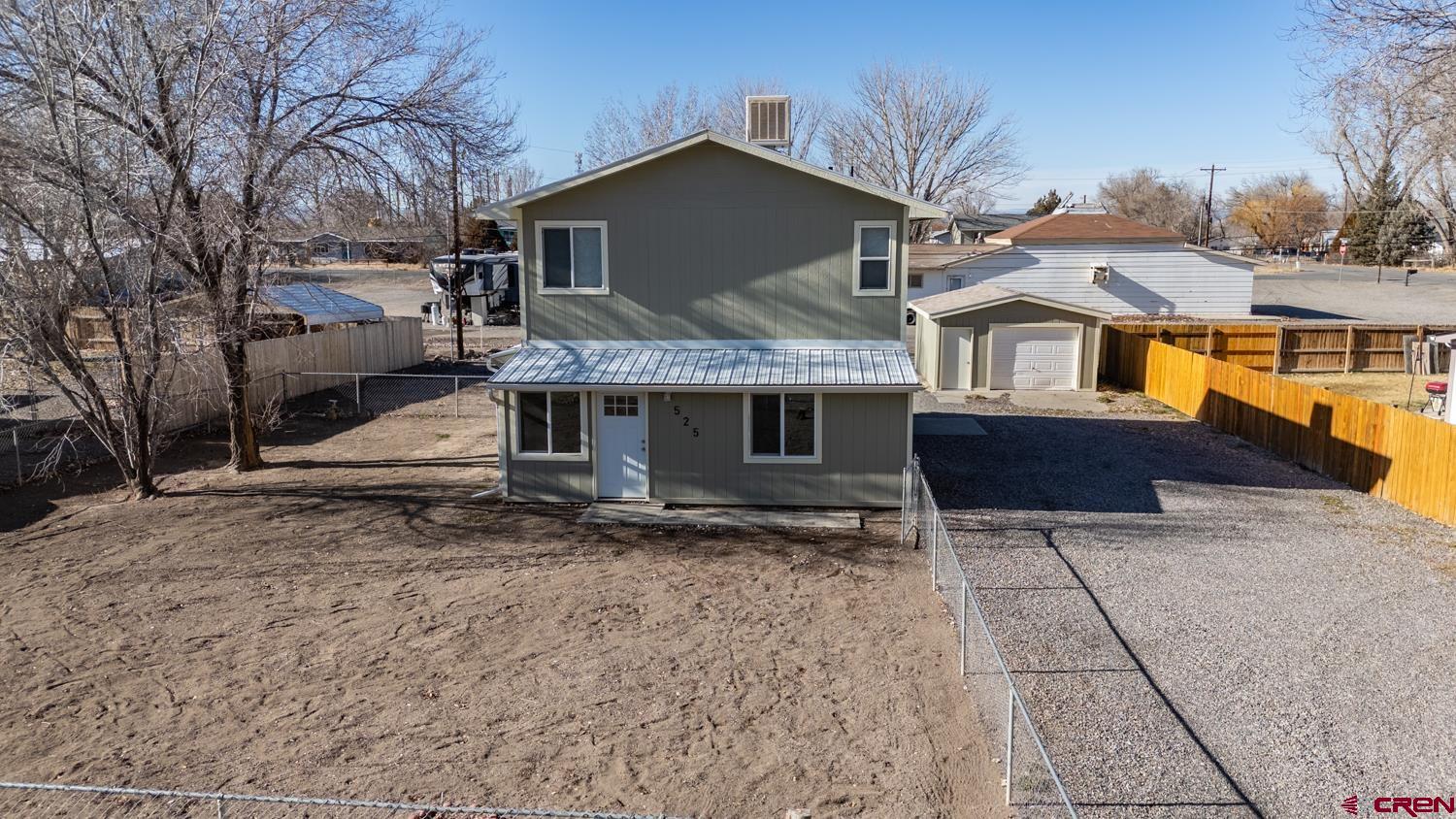 525 Elizabeth Street Delta, CO 81416 - Photo 28 of 30 a front view of a house with a yard and garage