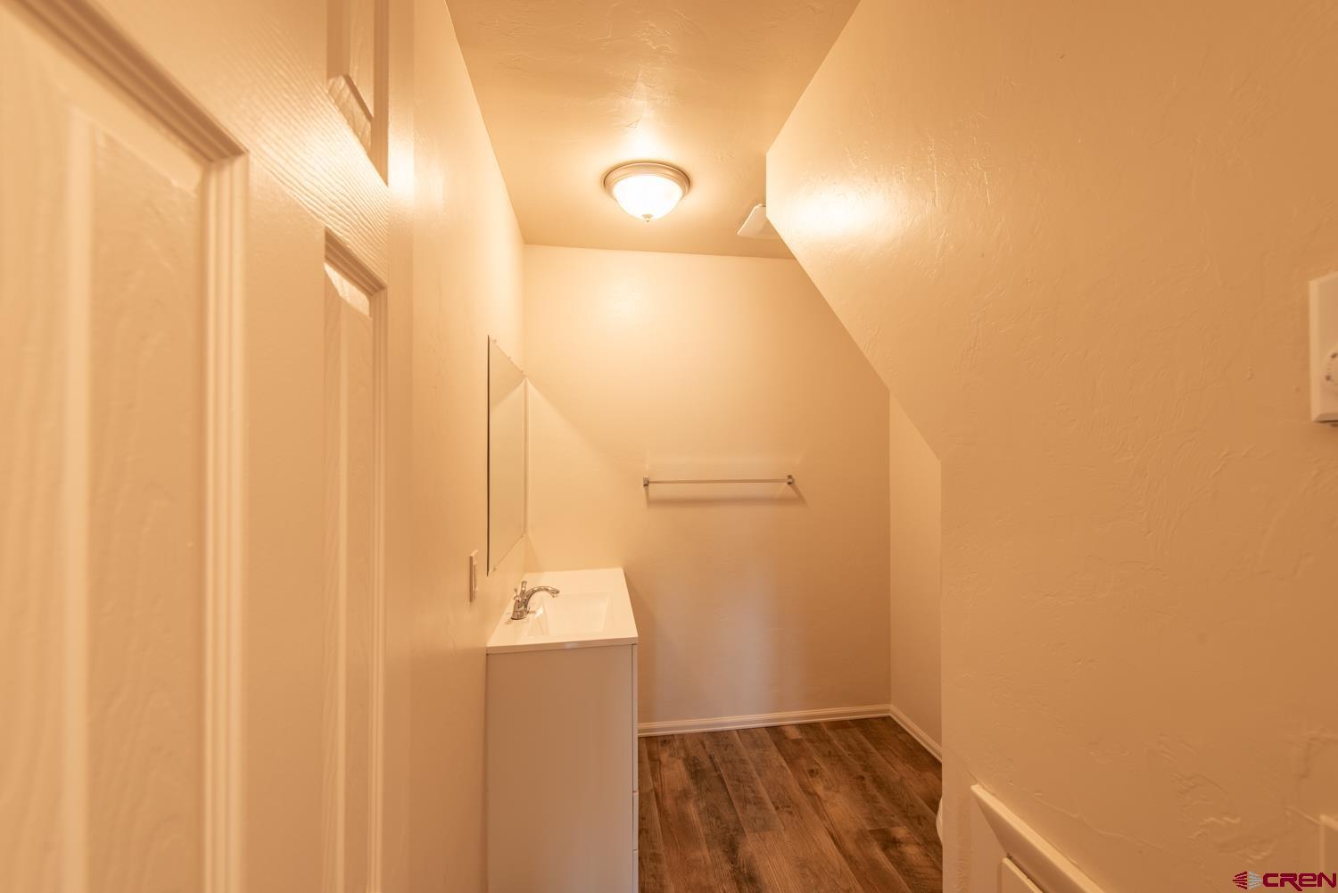 525 Elizabeth Street Delta, CO 81416 - Photo 10 of 30 a bathroom with a sink and a mirror
