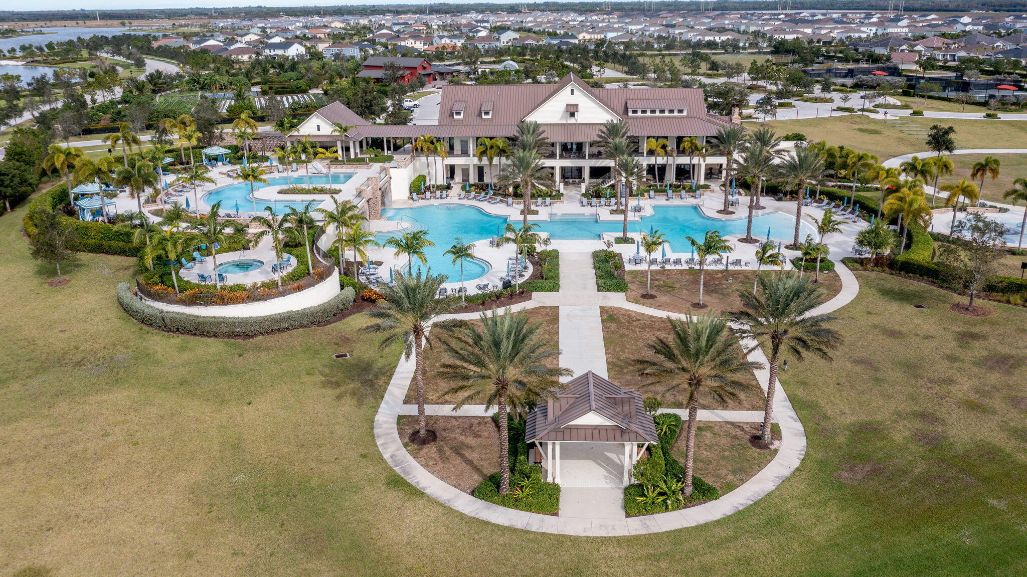 19546 Weathervane Way Loxahatchee, FL 33470 - Photo 61 of 63 an aerial view of a house with swimming pool and lake view
