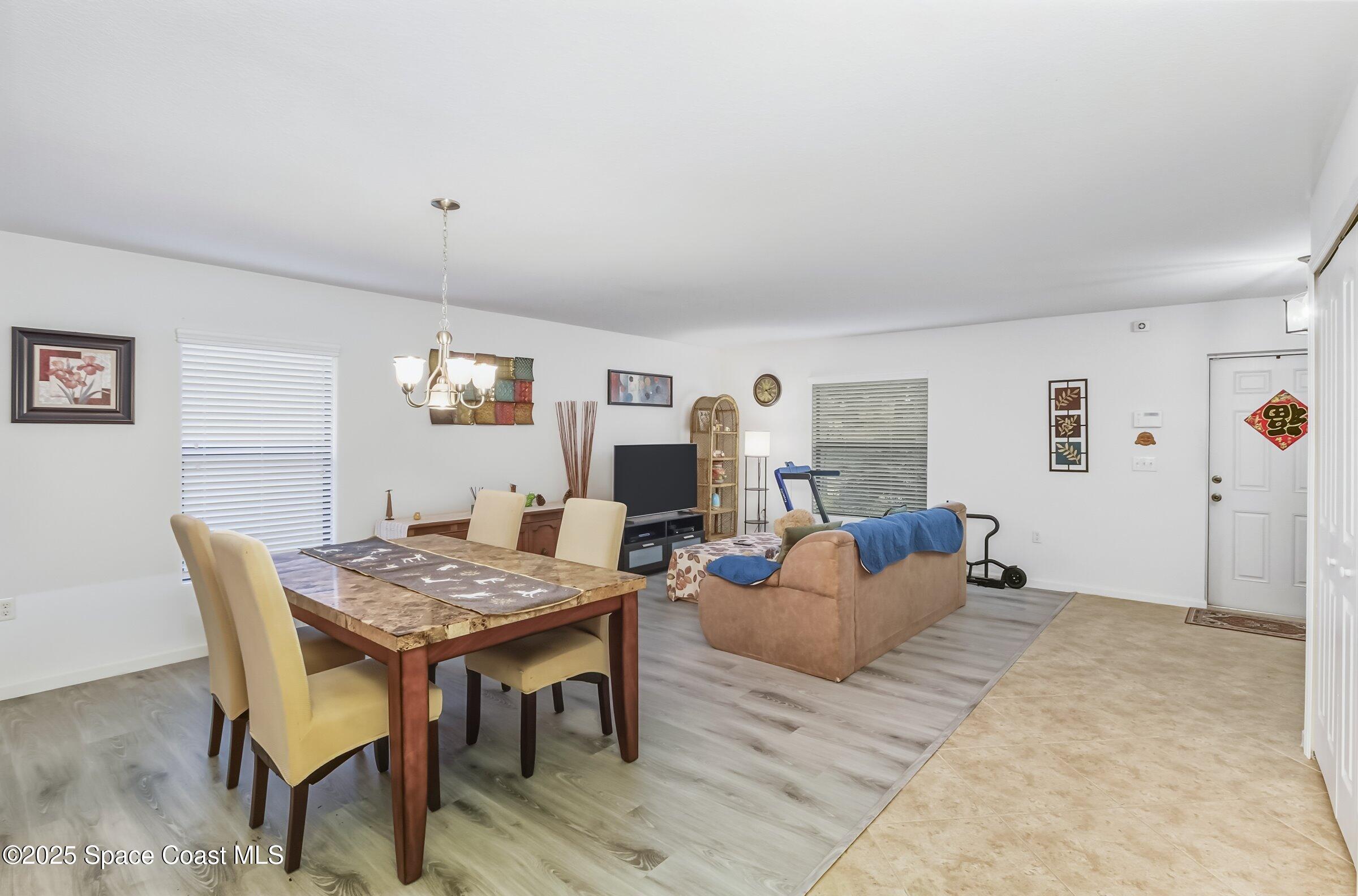 4300 Millicent Circle Melbourne, FL 32901 - Photo 18 of 29 a living room with furniture and a table