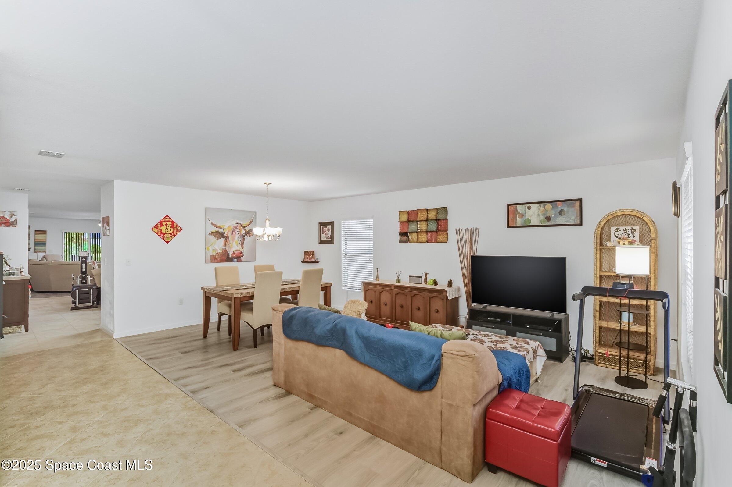 4300 Millicent Circle Melbourne, FL 32901 - Photo 19 of 29 a living room with furniture and a flat screen tv