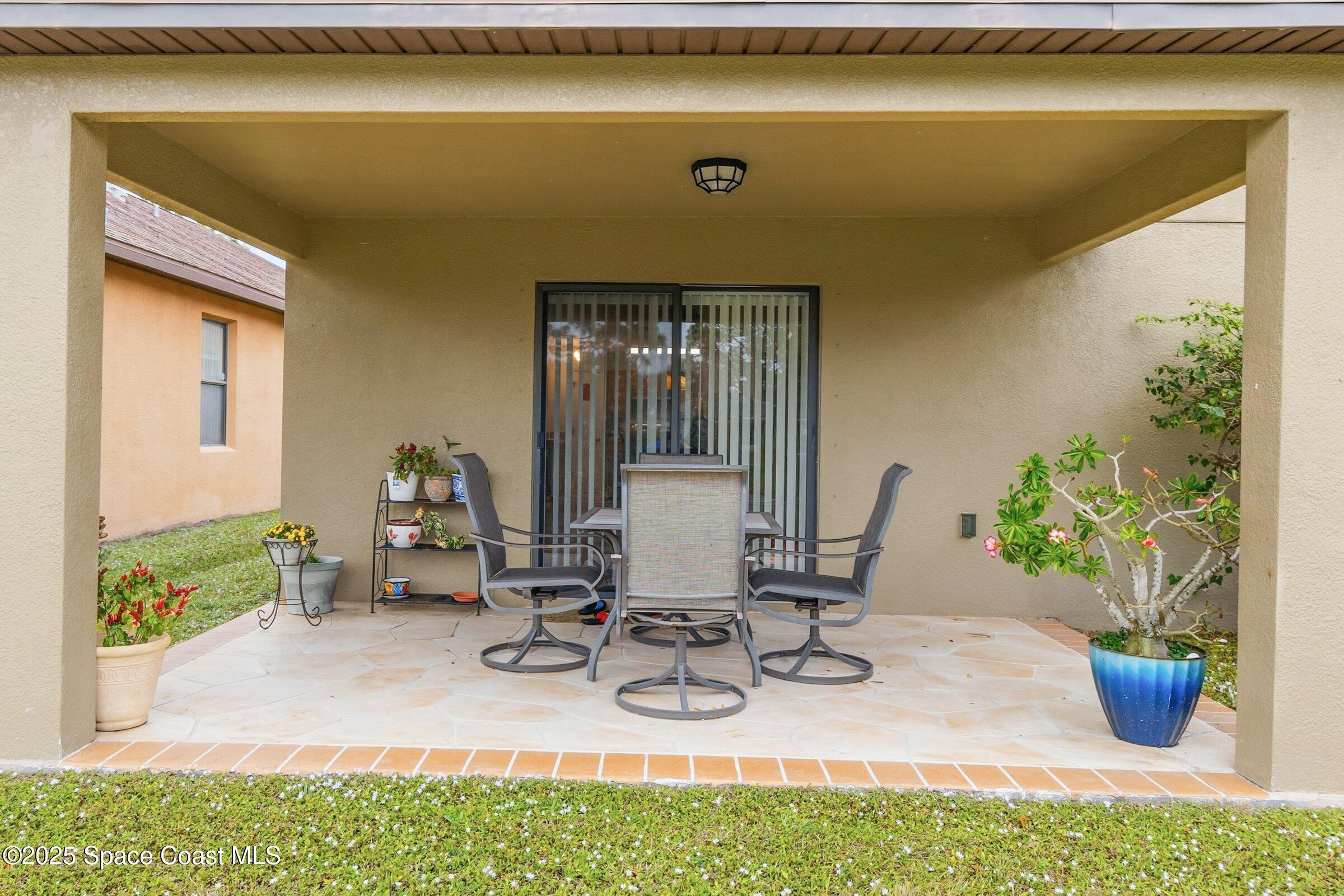4300 Millicent Circle Melbourne, FL 32901 - Photo 22 of 29 a view of a dining room with furniture and a potted plant