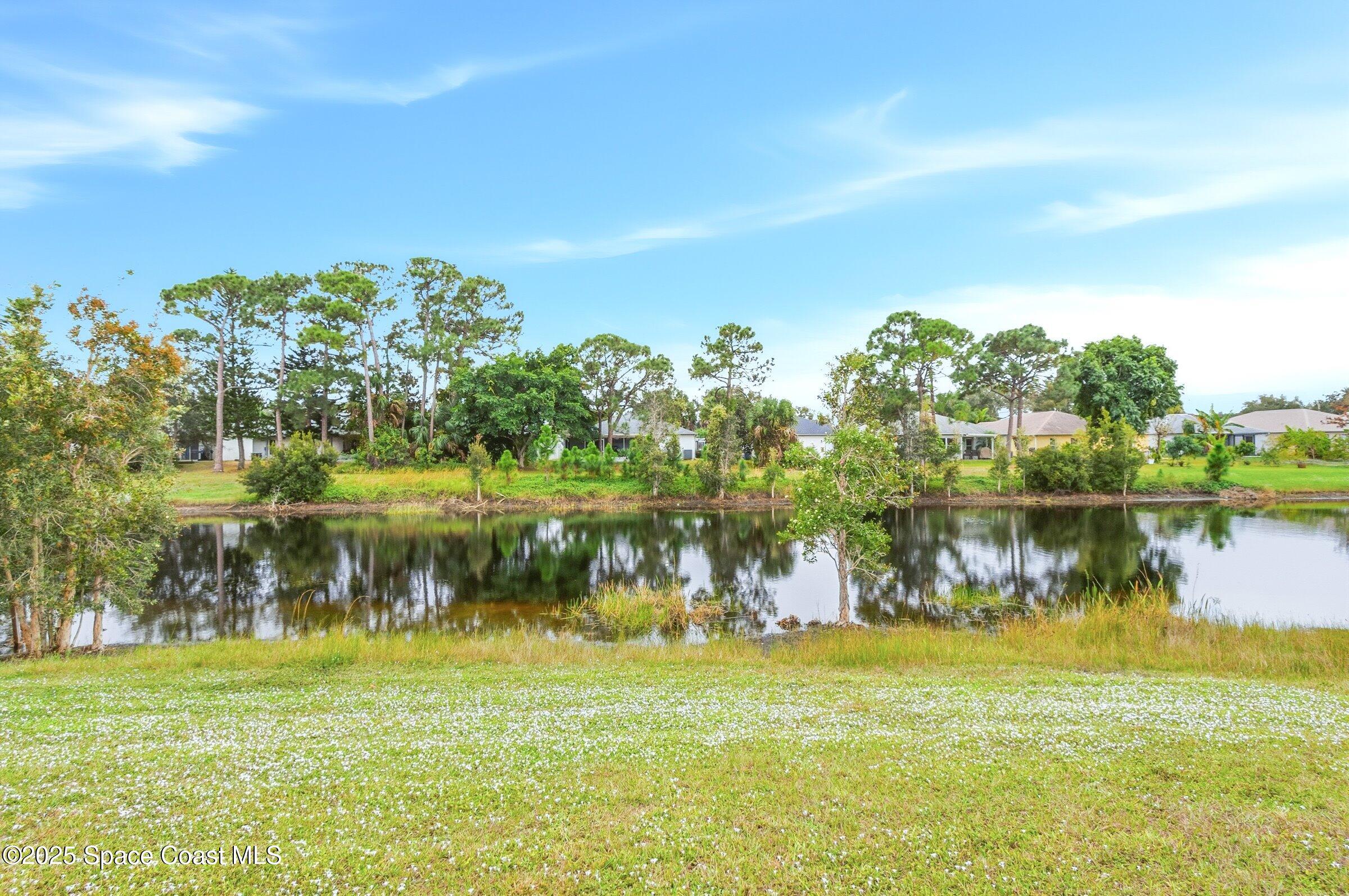 4300 Millicent Circle Melbourne, FL 32901 - Photo 25 of 29 a view of lake with green space