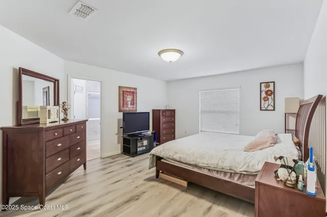 a bedroom with a bed and furniture