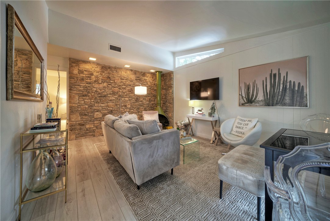3304 Bonnie Road, Unit A Austin, TX 78703 - Photo 1 of 1 a living room with furniture and a flat screen tv