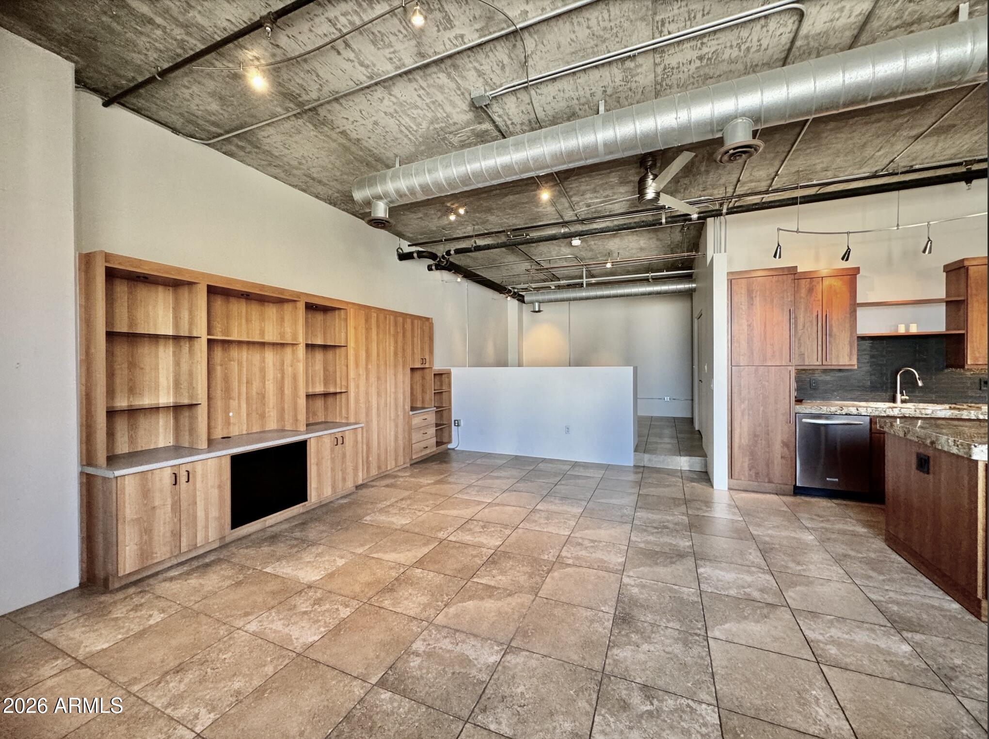 21 East 6th Street, Unit 306 Tempe, AZ 85281 - Photo 13 of 31 a view of a kitchen with furniture and a kitchen