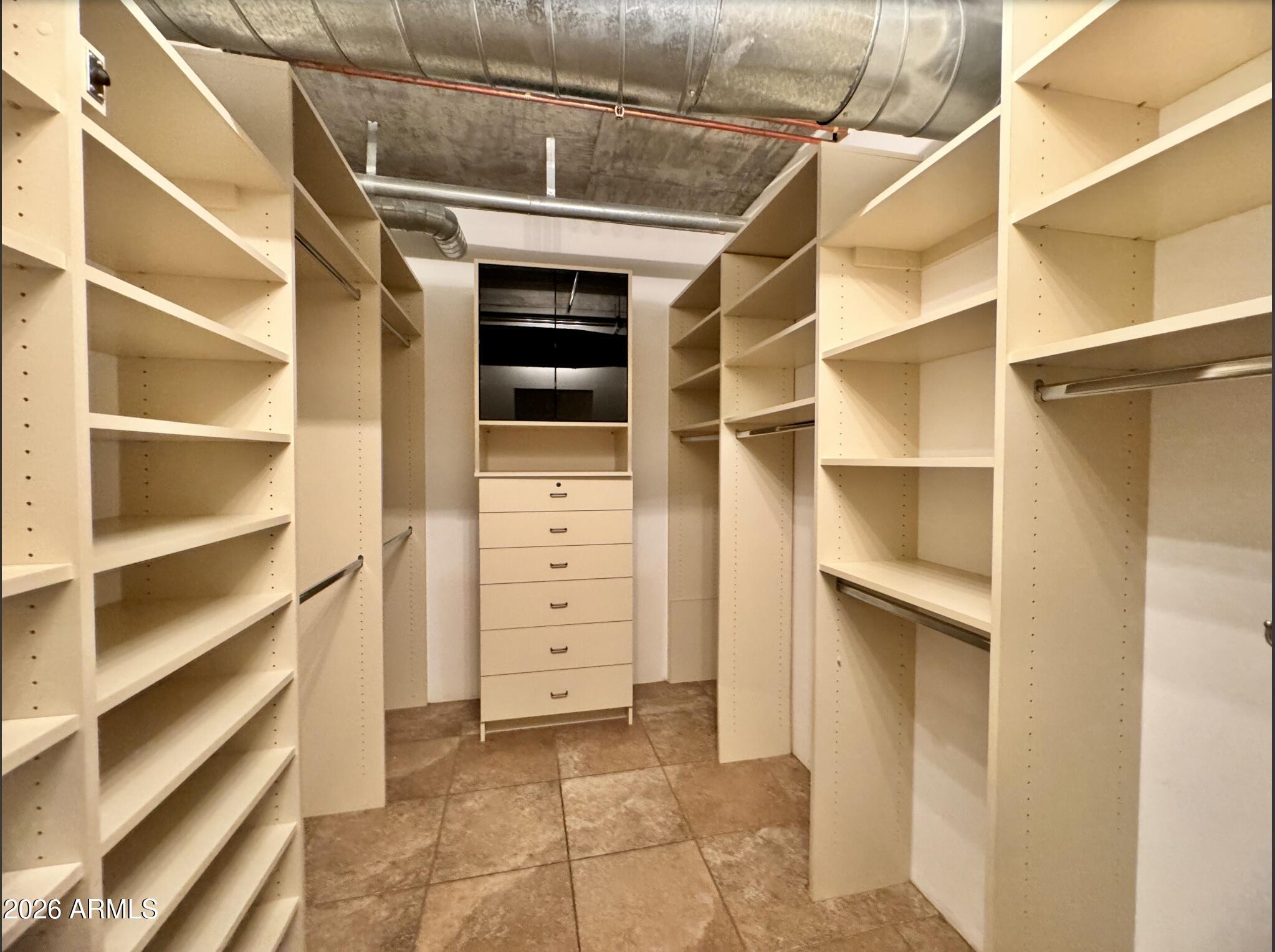 21 East 6th Street, Unit 306 Tempe, AZ 85281 - Photo 25 of 31 a view of walk in closet with empty racks