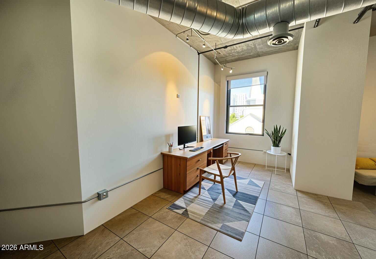 21 East 6th Street, Unit 306 Tempe, AZ 85281 - Photo 3 of 31 a workspace with furniture and a window