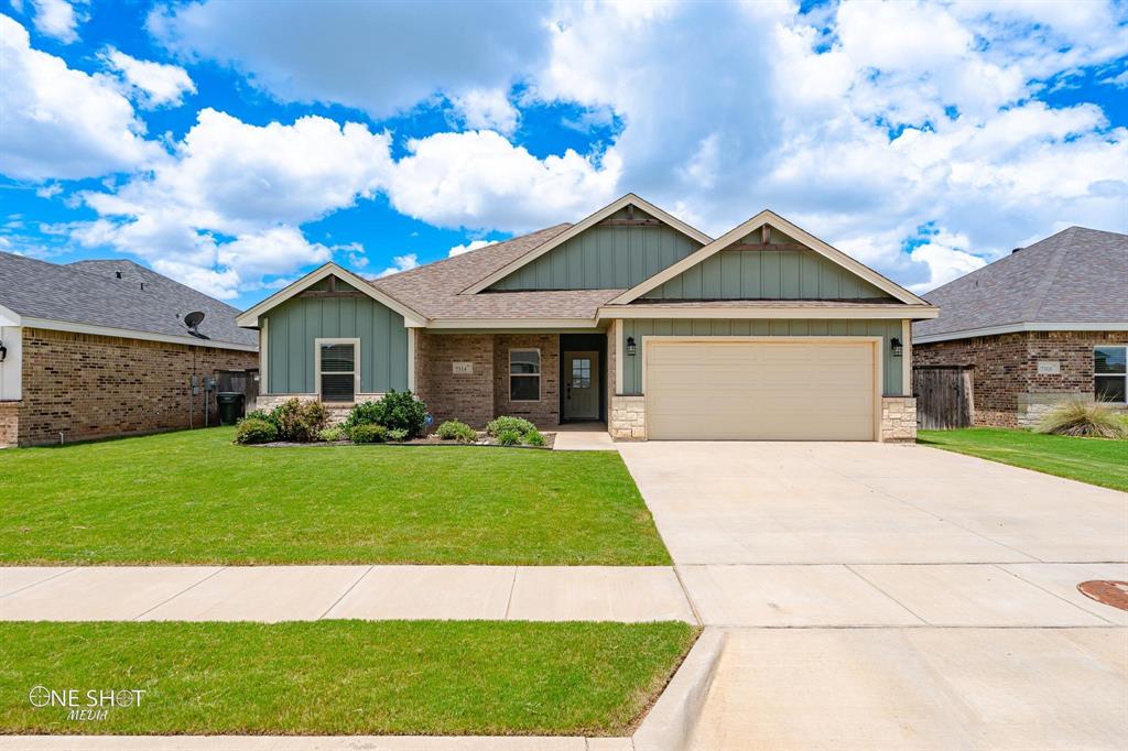 7314 Connor Road Abilene, TX 79602 - Photo 1 of 1 Craftsman-style home featuring a garage and a front yard