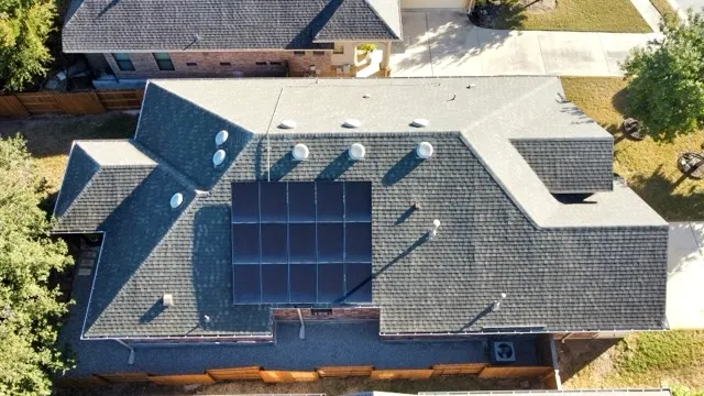 an aerial view of house with yard