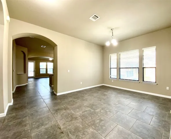 a view of a room with large windows