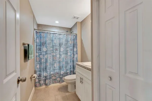 a bathroom with a shower curtain