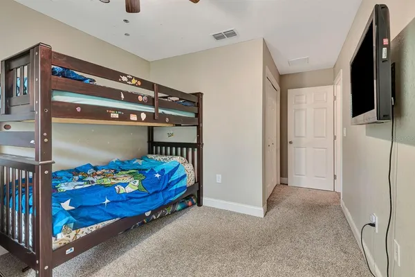 a bed room with a bed and a baby crib