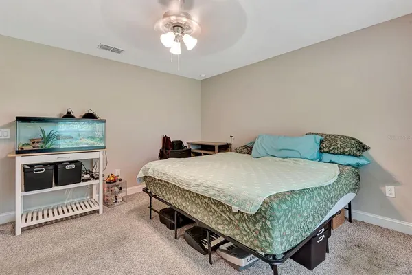 a bedroom with a bed and a fireplace