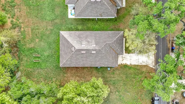 a front view of a house with yard