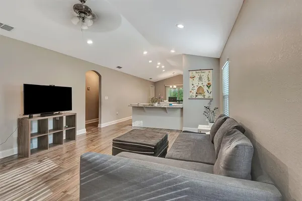 a living room with furniture and a flat screen tv