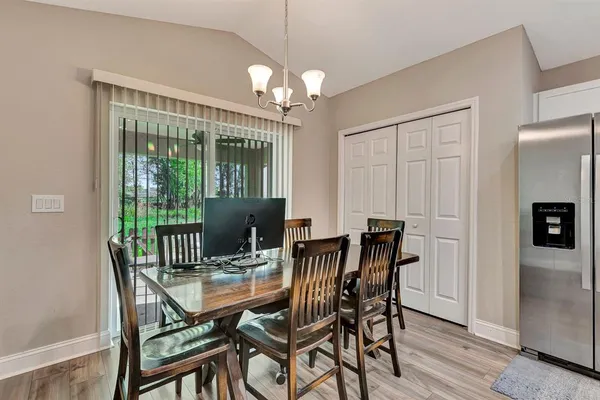 a view of a dining room with furniture window and outside view