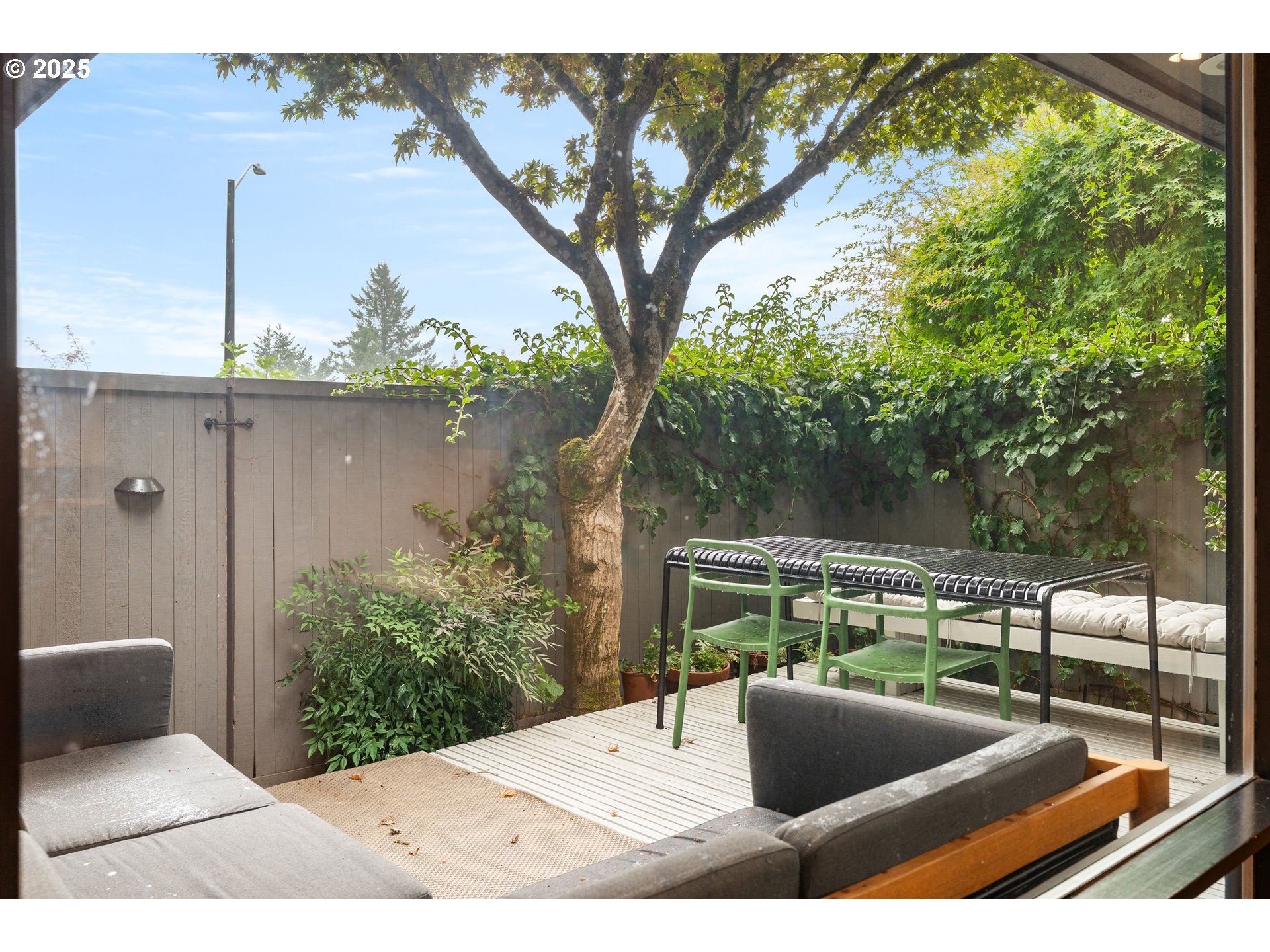 1555 Southwest Miller Court Gresham, OR 97080 - Photo 13 of 47 a view of roof deck with couches and wooden fence