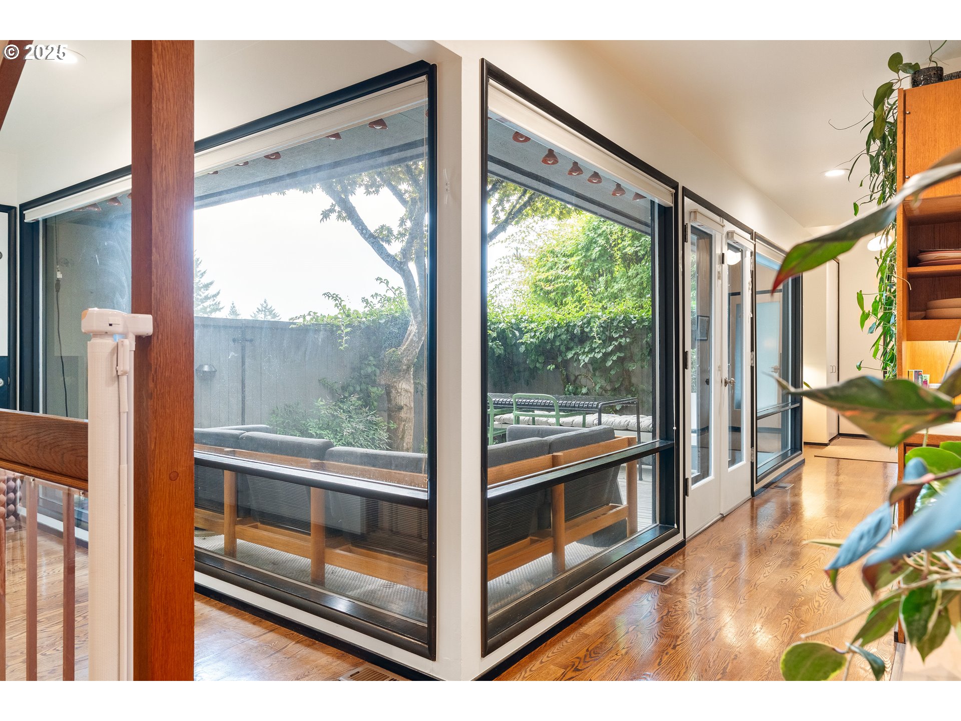 1555 Southwest Miller Court Gresham, OR 97080 - Photo 14 of 47 a view of a floor to ceiling window and an kitchen