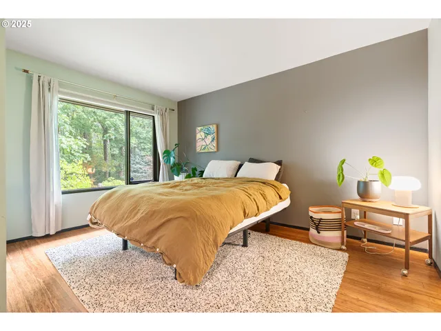 a bathroom with a granite countertop sink a toilet and a mirror