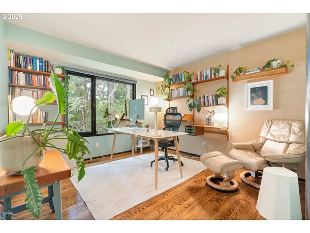 a bedroom with a large bed and a large window