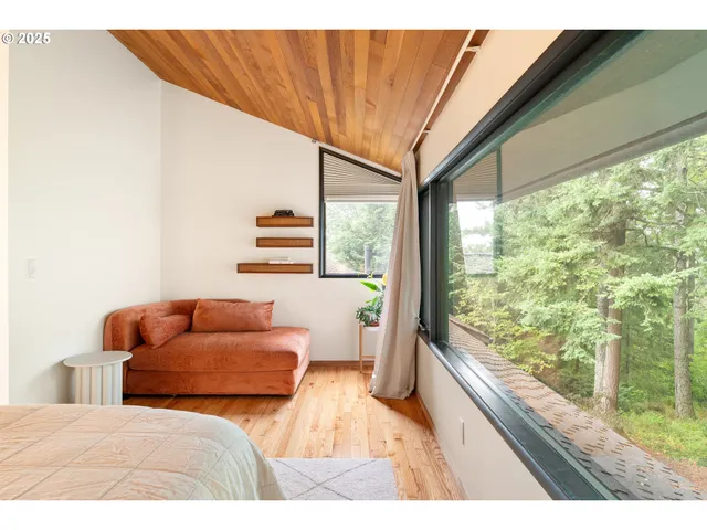 a bedroom with a bed and a night stand