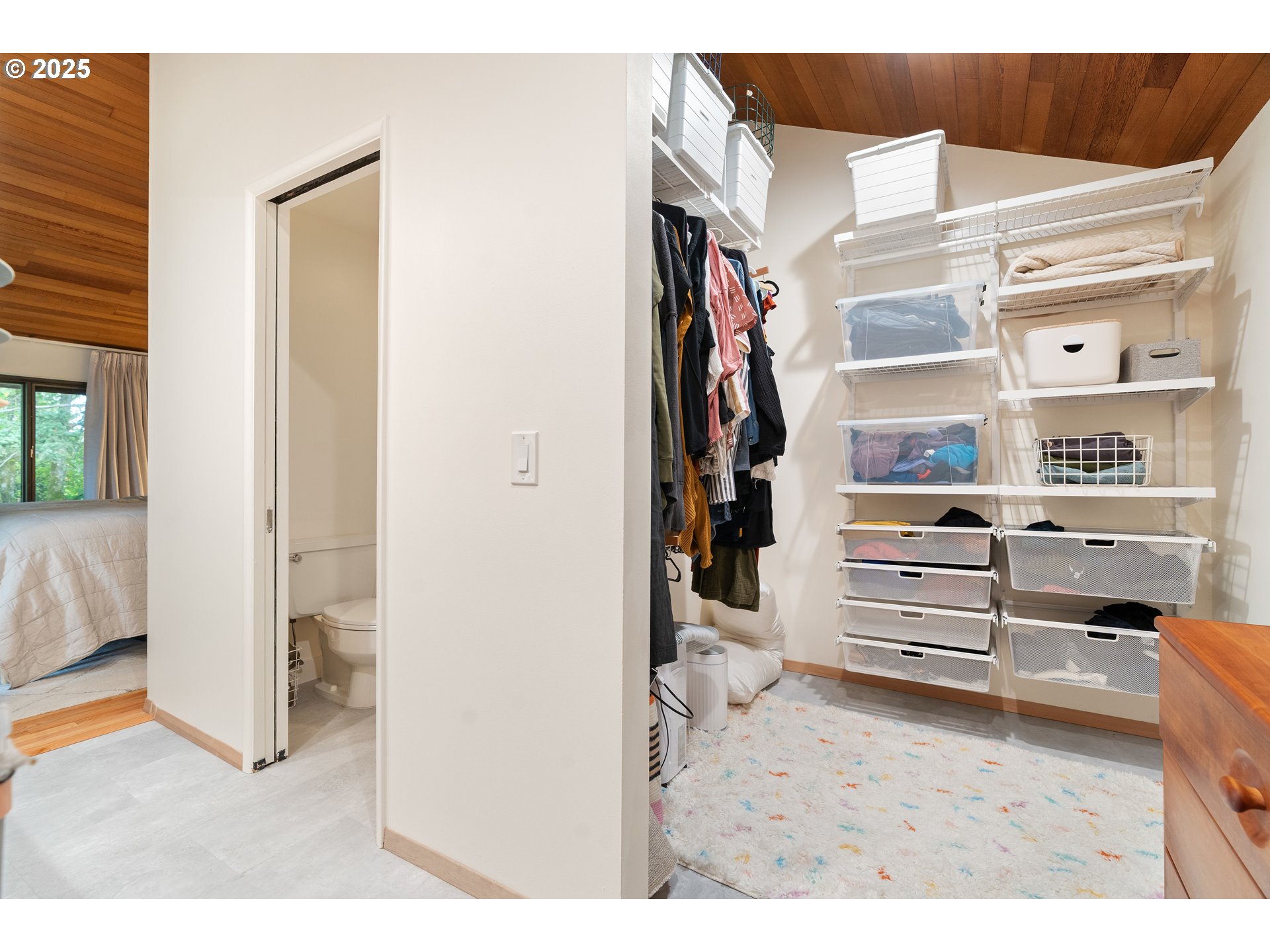 1555 Southwest Miller Court Gresham, OR 97080 - Photo 29 of 47 a view of walk in closet with clothes and shoes