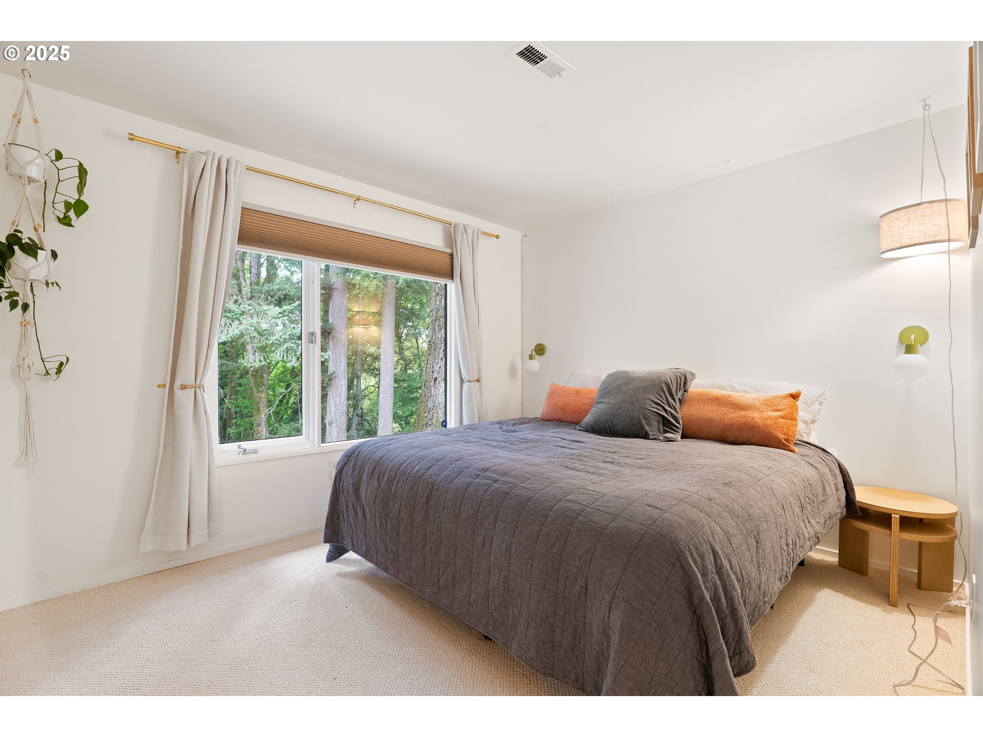 1555 Southwest Miller Court Gresham, OR 97080 - Photo 30 of 47 a bedroom with a bed and a large window