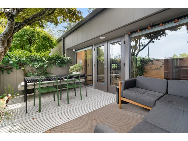 a backyard of a house with outdoor seating
