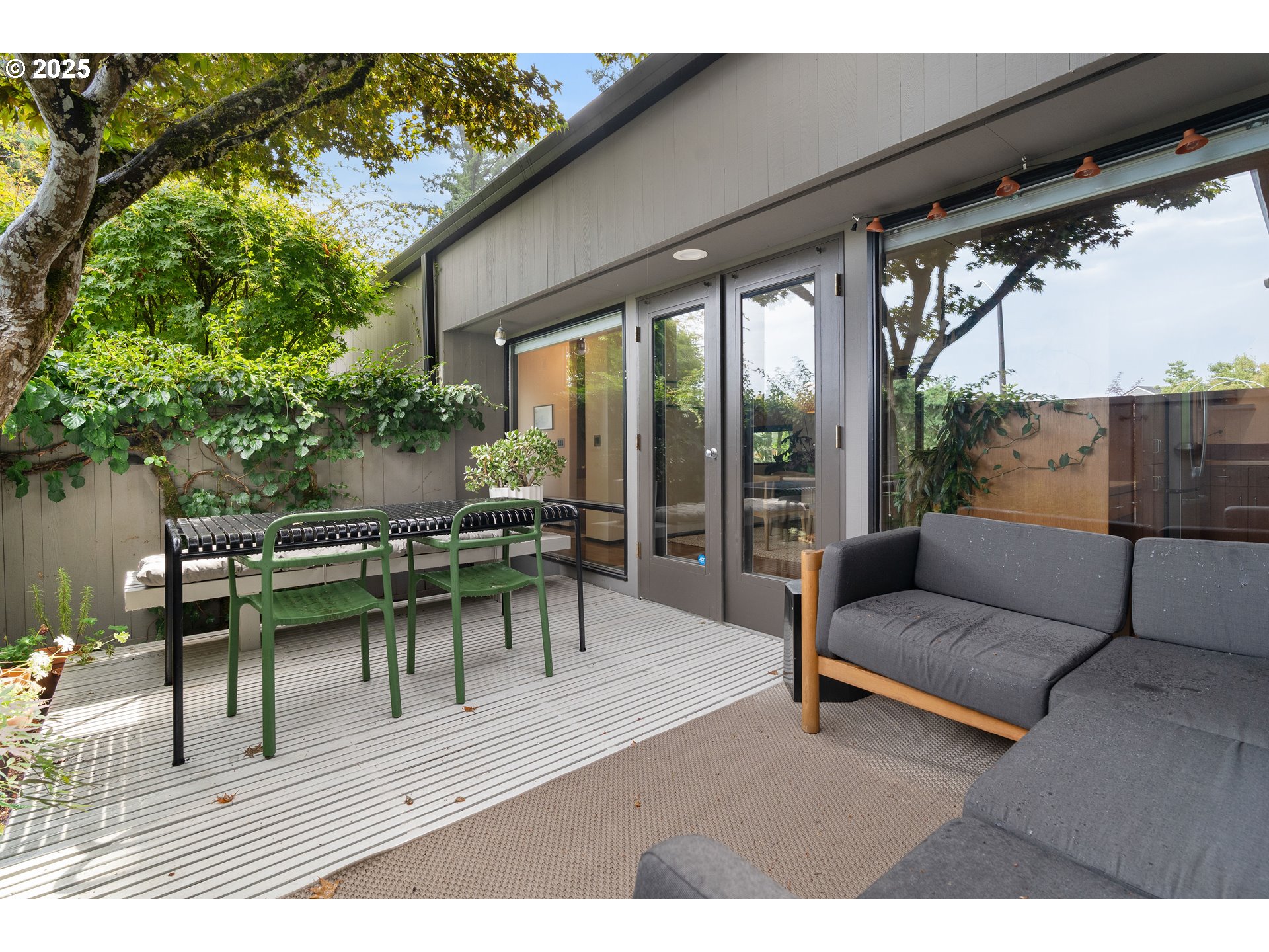 1555 Southwest Miller Court Gresham, OR 97080 - Photo 37 of 47 a view of a porch with furniture and a yard