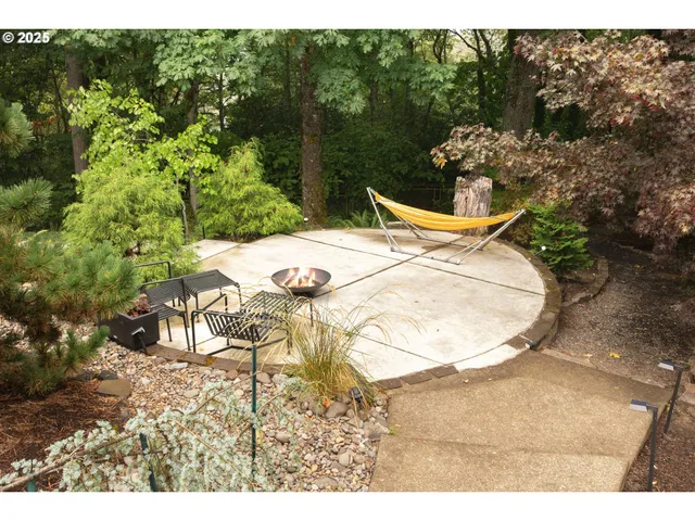 an aerial view of a house a yard and a garden