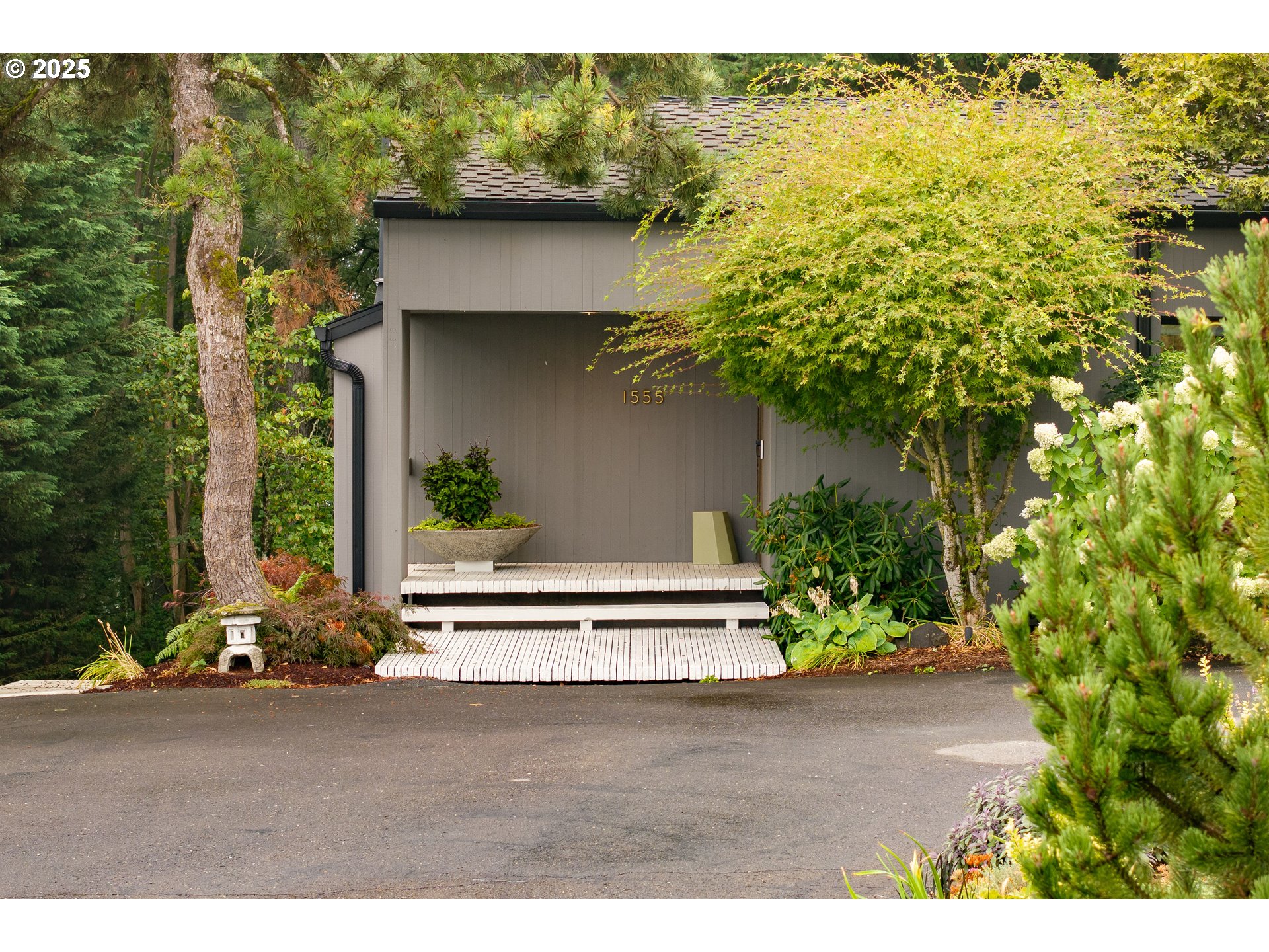 1555 Southwest Miller Court Gresham, OR 97080 - Photo 45 of 47 a backyard of a house with lots of green space
