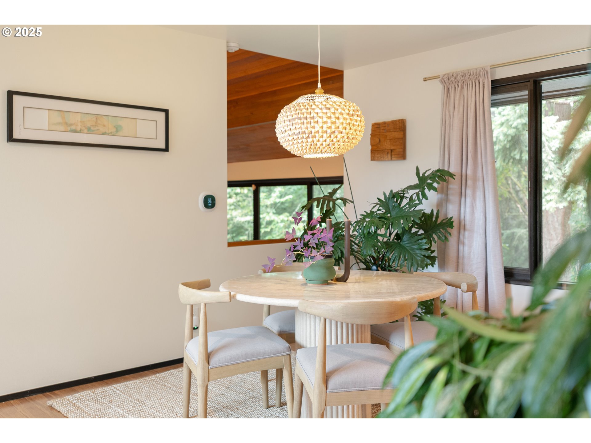 1555 Southwest Miller Court Gresham, OR 97080 - Photo 9 of 47 a view of a dining room with furniture and a potted plant