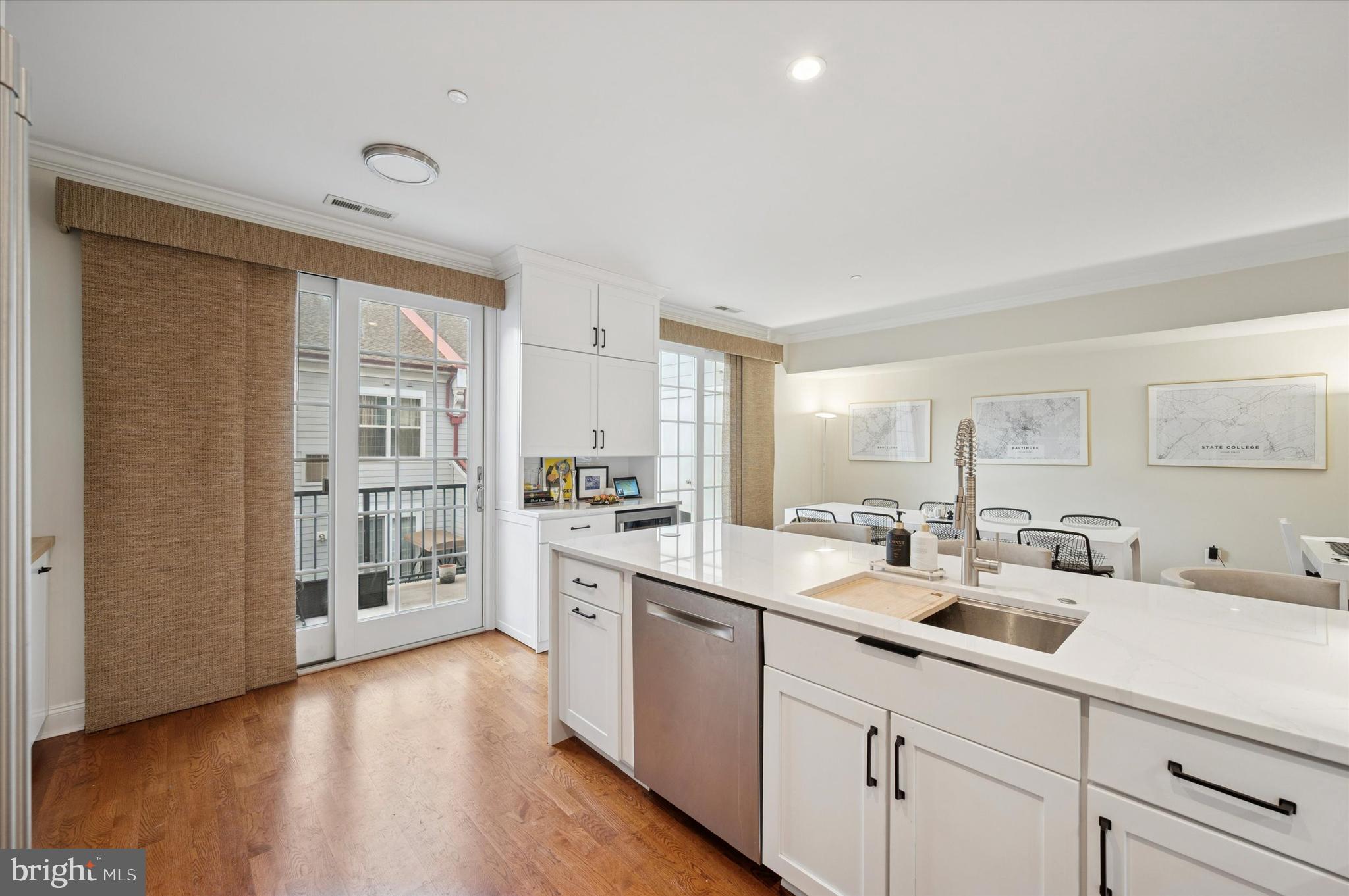 610 Captains Way Philadelphia, PA 19146 - Photo 11 of 25 a kitchen with white cabinets and sink