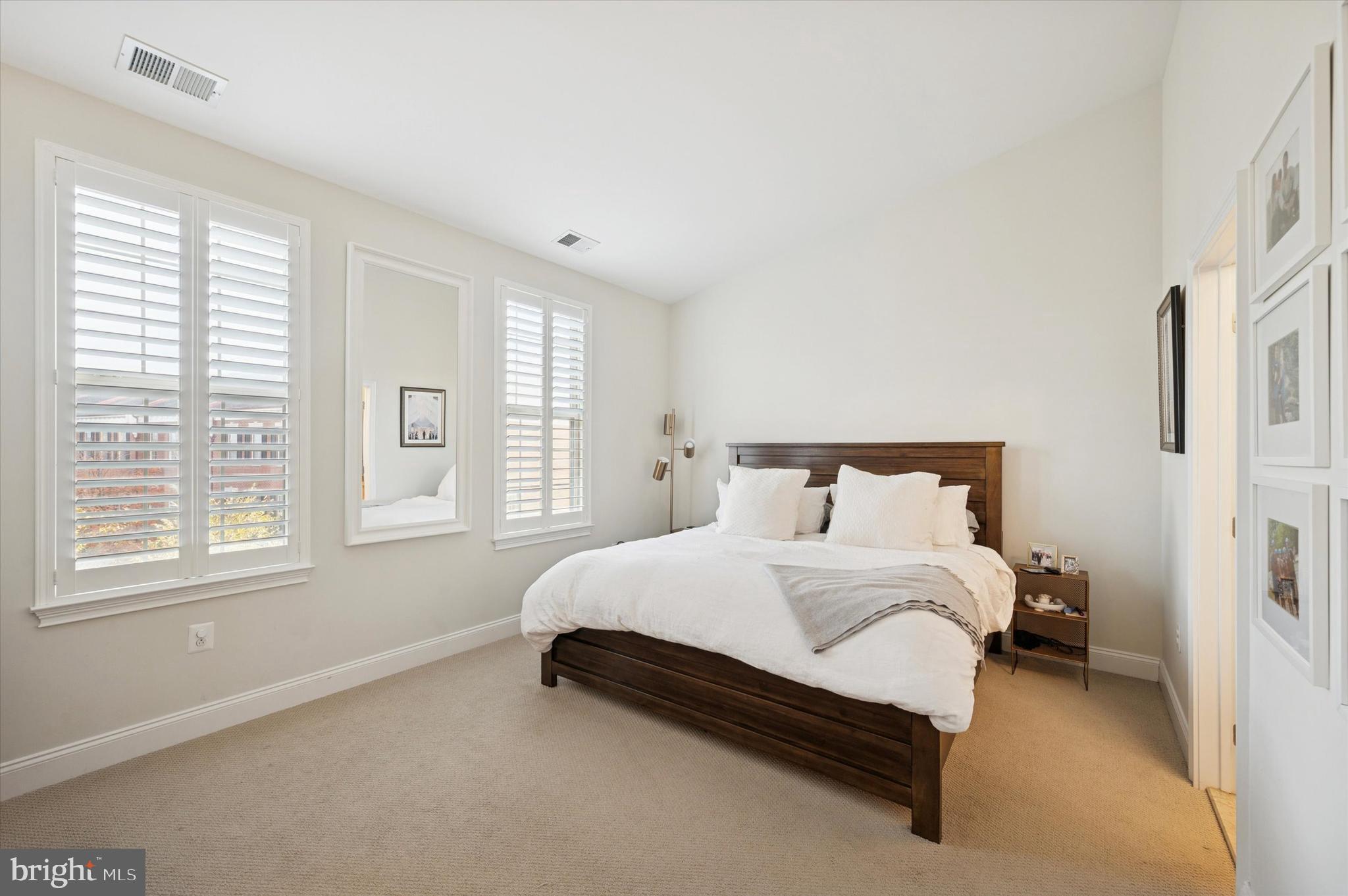 610 Captains Way Philadelphia, PA 19146 - Photo 18 of 25 a large bed sitting in a bedroom next to a window
