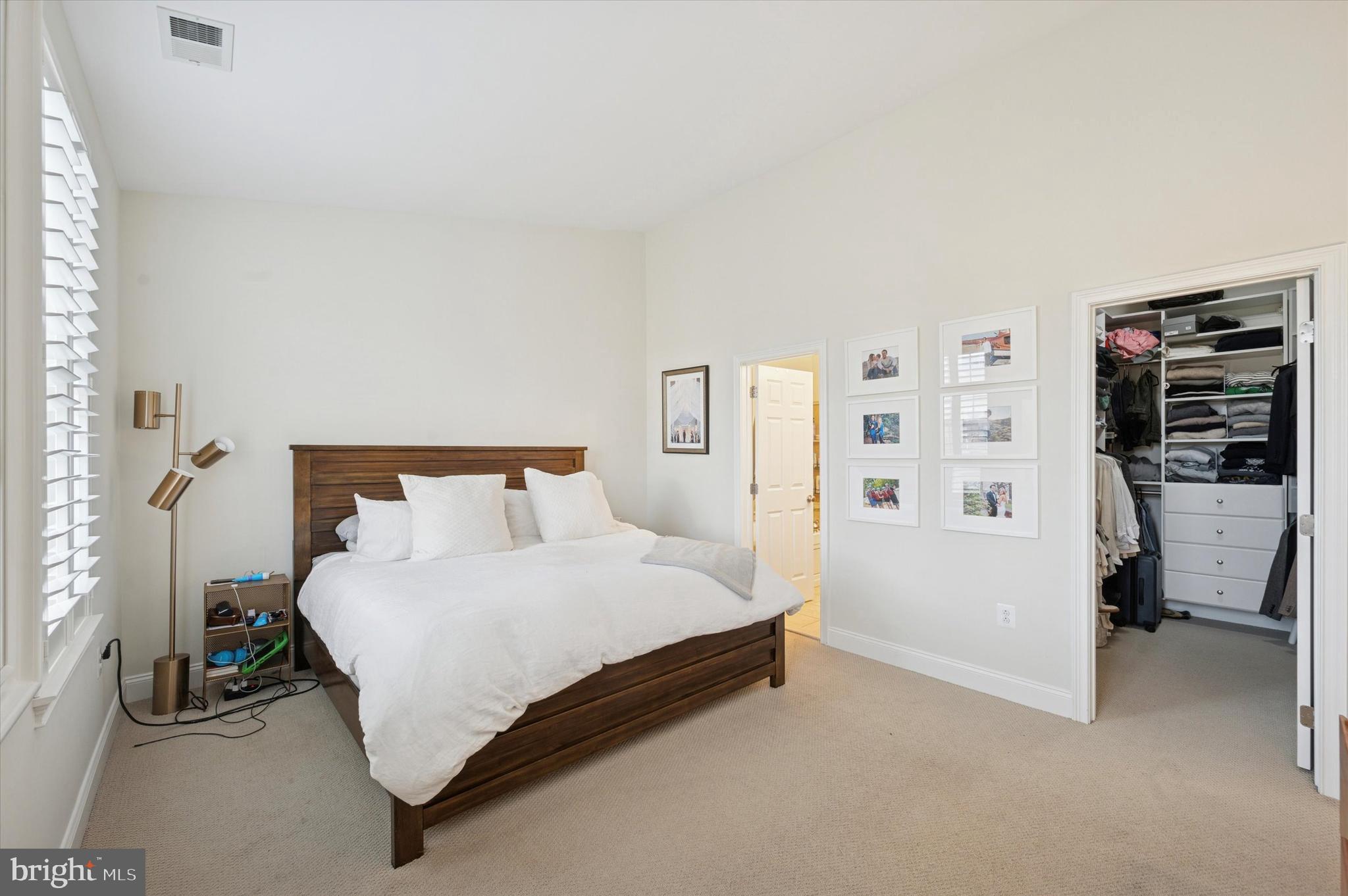 610 Captains Way Philadelphia, PA 19146 - Photo 19 of 25 a bedroom with a bed and a walk in closet