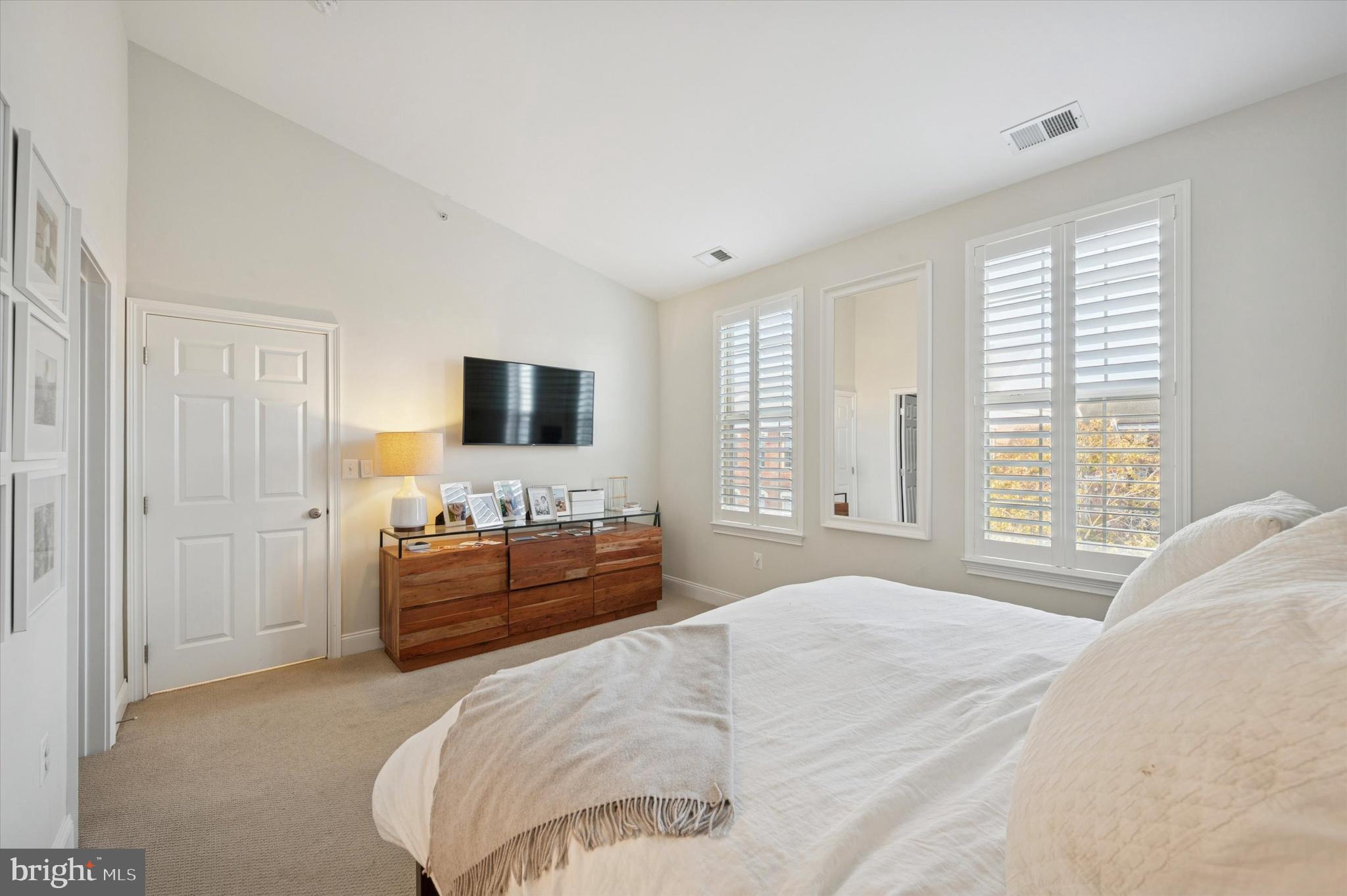 610 Captains Way Philadelphia, PA 19146 - Photo 20 of 25 a bedroom with a bed and a flat screen tv