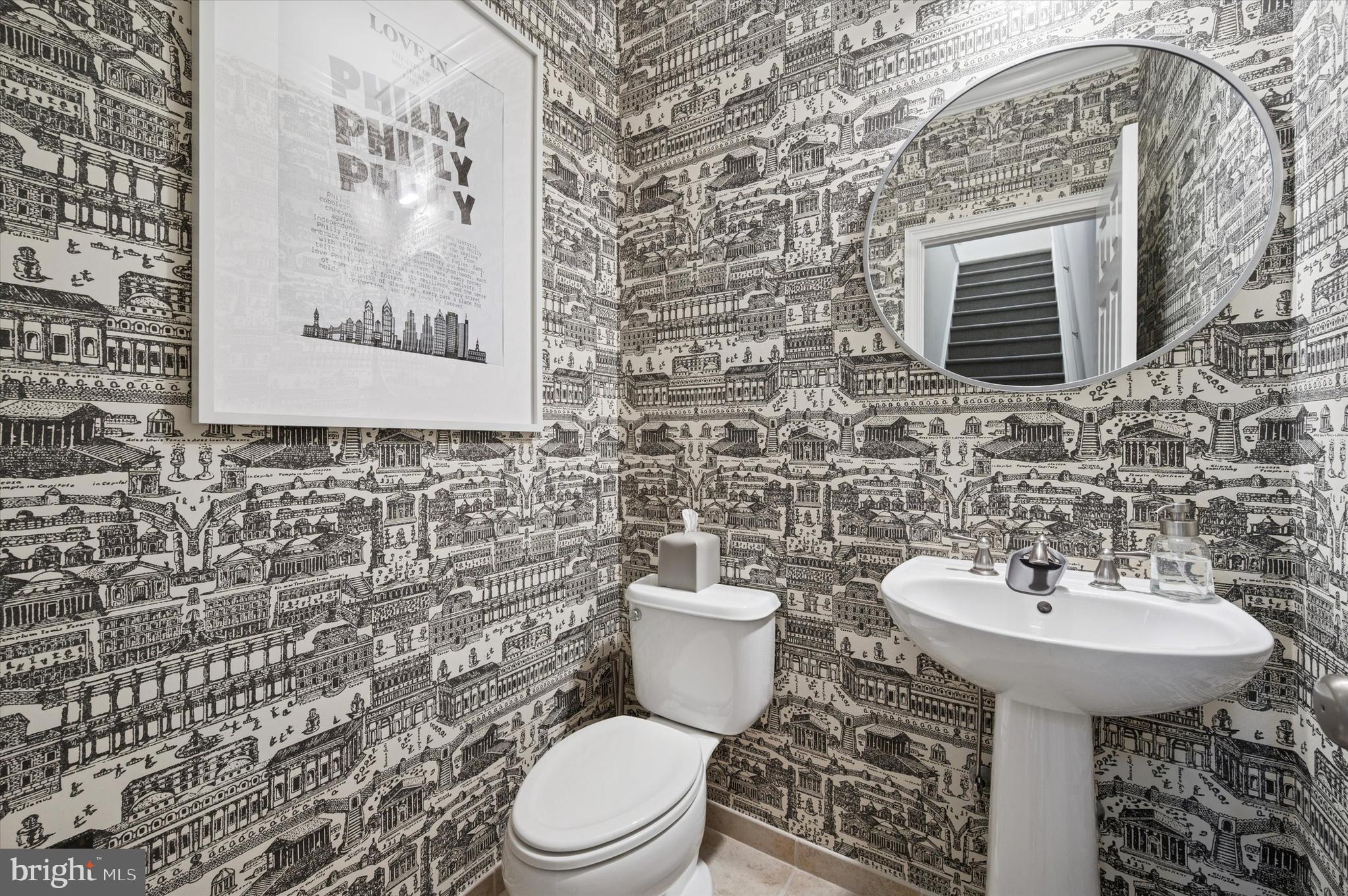 610 Captains Way Philadelphia, PA 19146 - Photo 5 of 25 a bathroom with a toilet sink and mirror