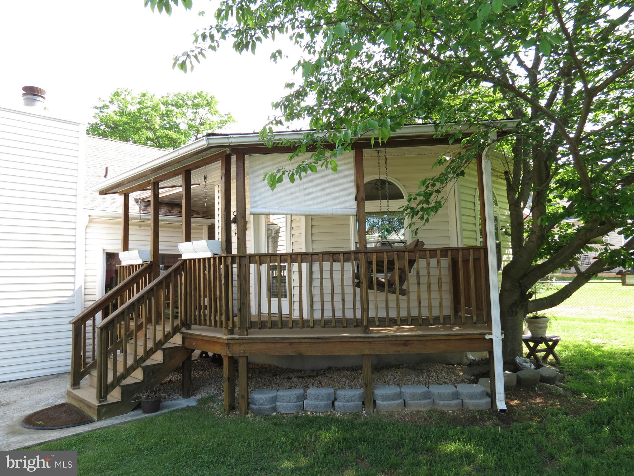 549 Forest View Road Linthicum Heights, MD 21090 - Photo 22 of 30 a view of backyard with deck and a garden