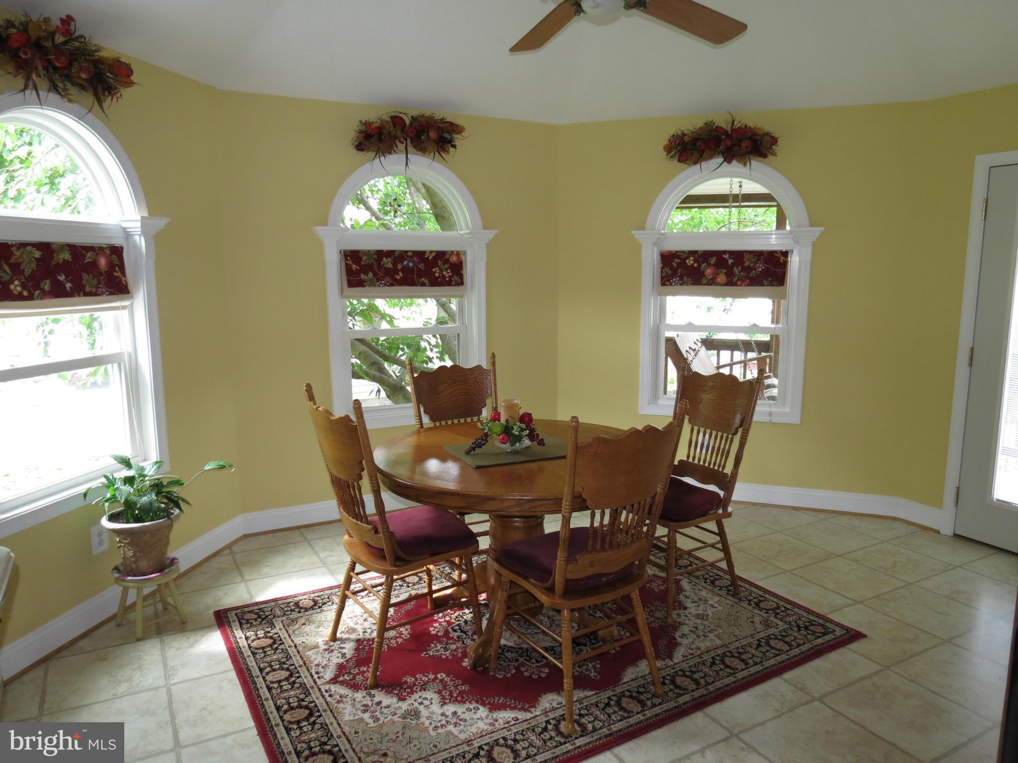549 Forest View Road Linthicum Heights, MD 21090 - Photo 5 of 30 a view of a dining room with furniture and a window