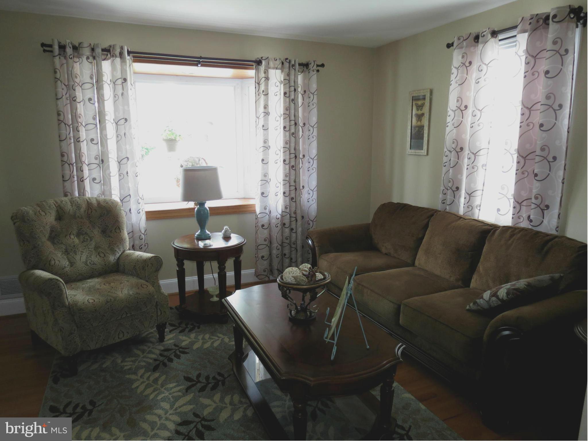 549 Forest View Road Linthicum Heights, MD 21090 - Photo 6 of 30 a living room with furniture and a large window