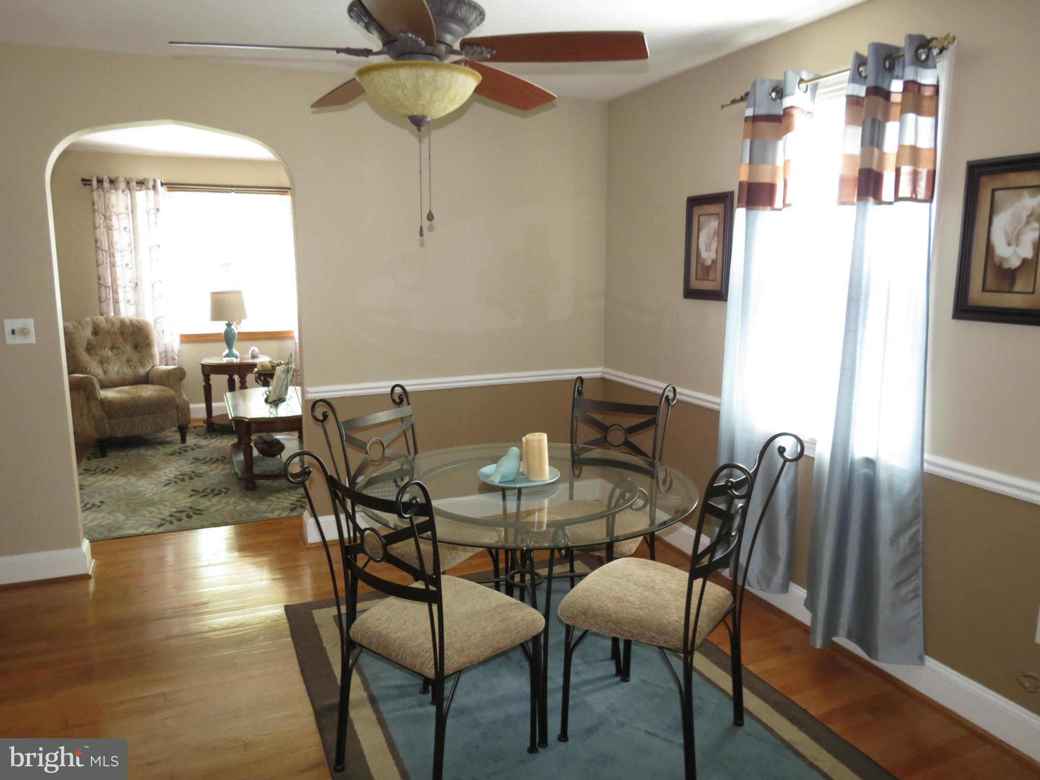 549 Forest View Road Linthicum Heights, MD 21090 - Photo 8 of 30 a view of a dining room with furniture and wooden floor