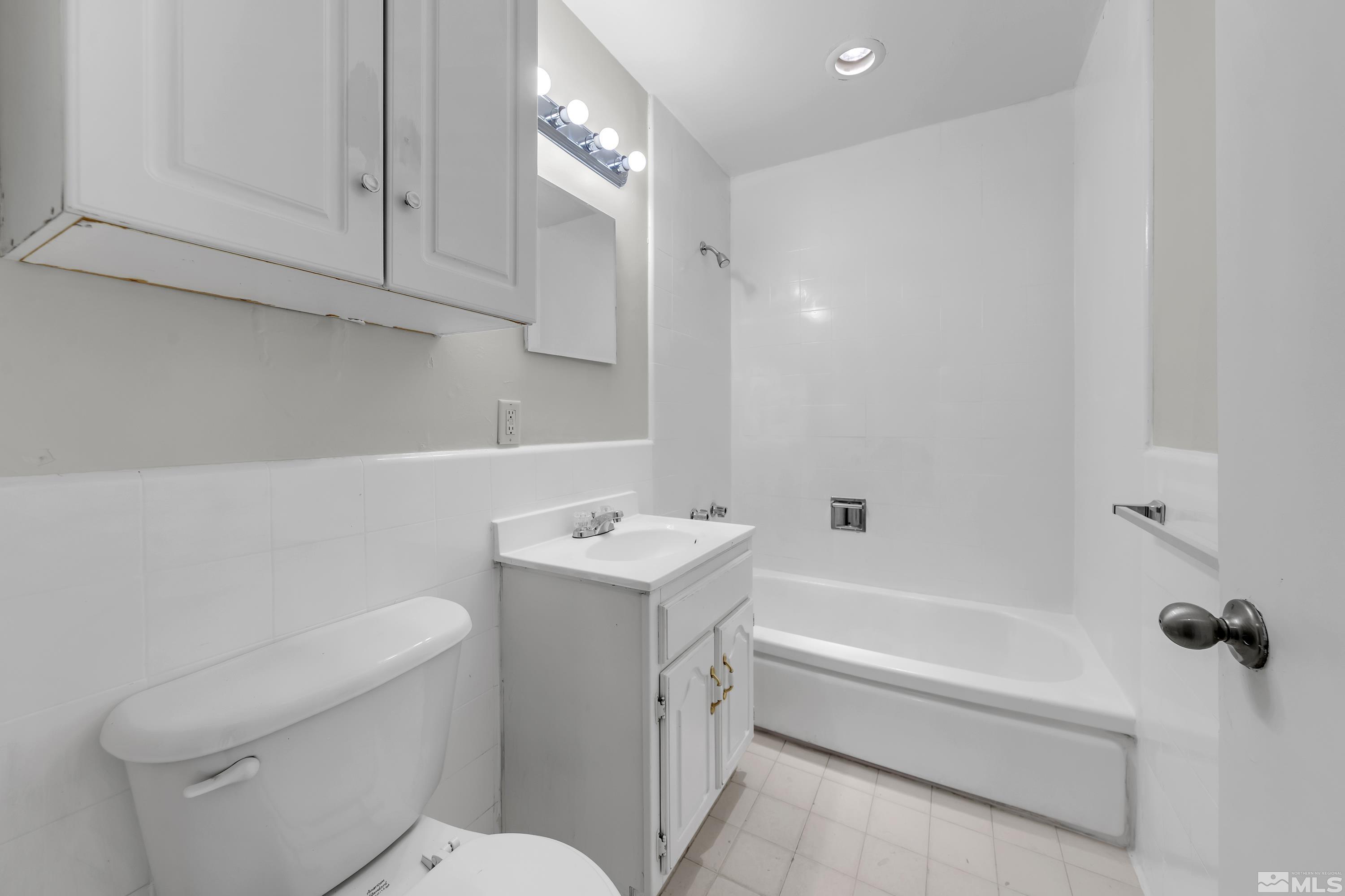 12000 Rocky Mountain Street Reno, NV 89506 - Photo 19 of 40 a bathroom with a sink a toilet and bathtub