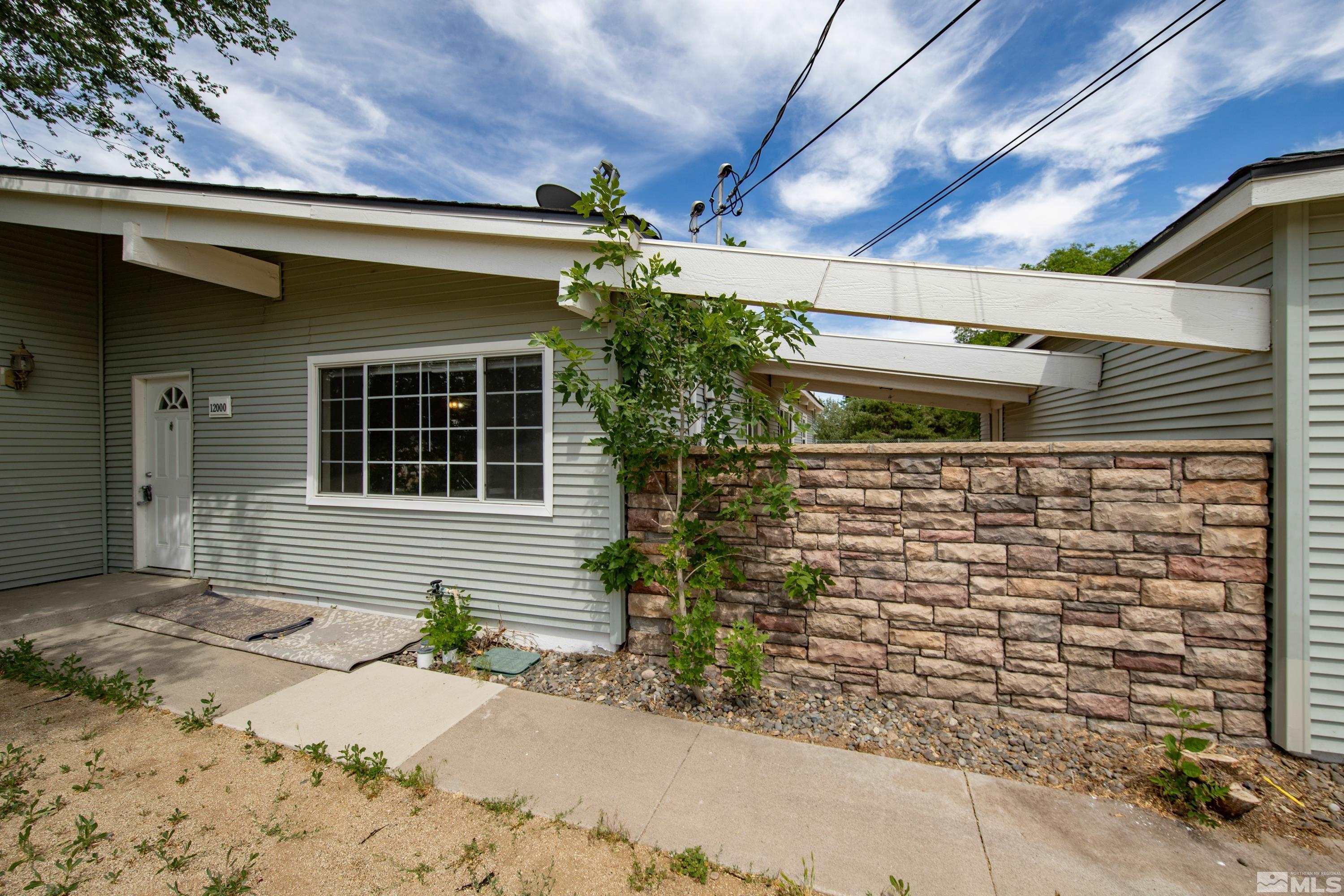 12000 Rocky Mountain Street Reno, NV 89506 - Photo 21 of 40 a front view of a house with a yard