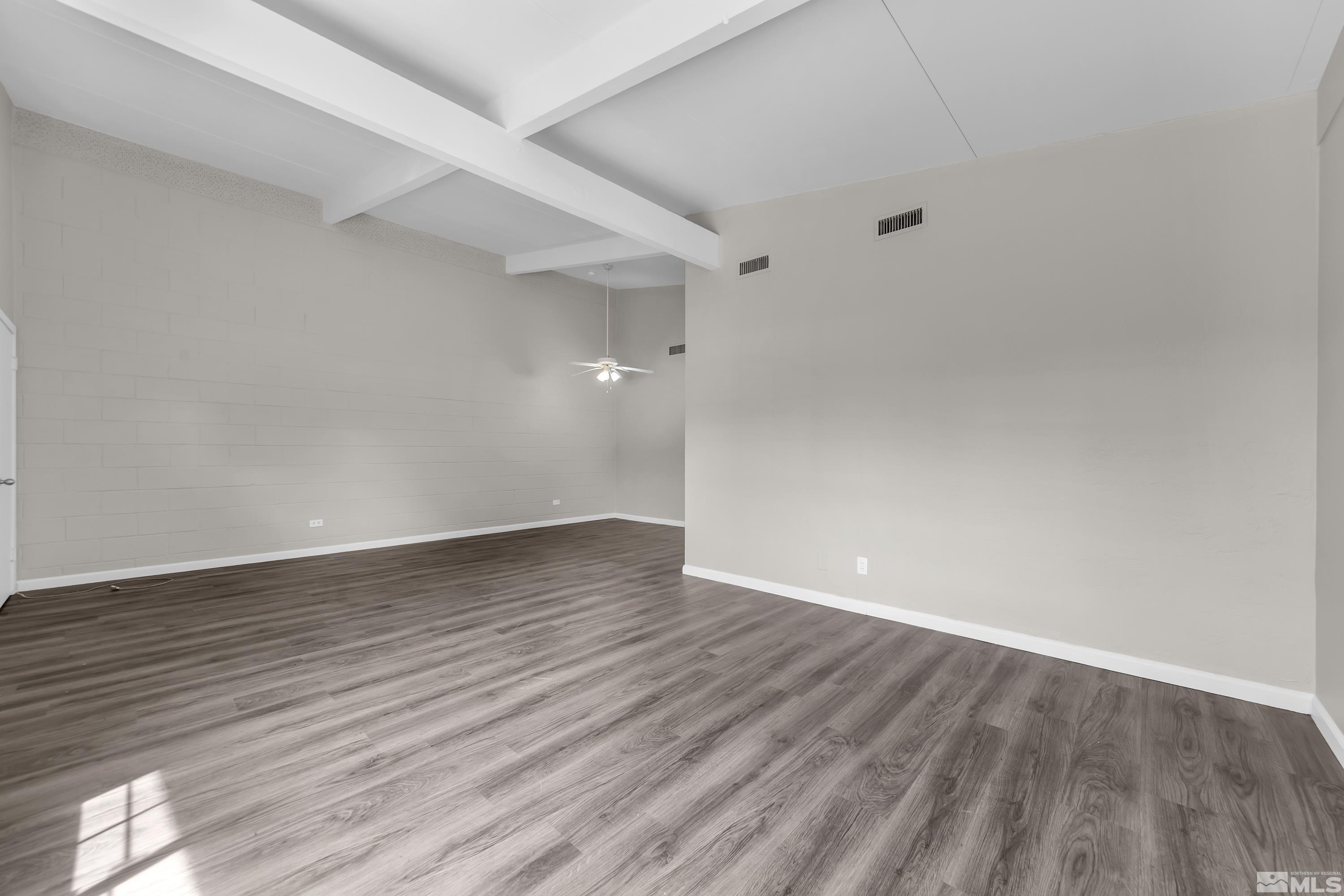 12000 Rocky Mountain Street Reno, NV 89506 - Photo 6 of 40 a view of an empty room with wooden floor