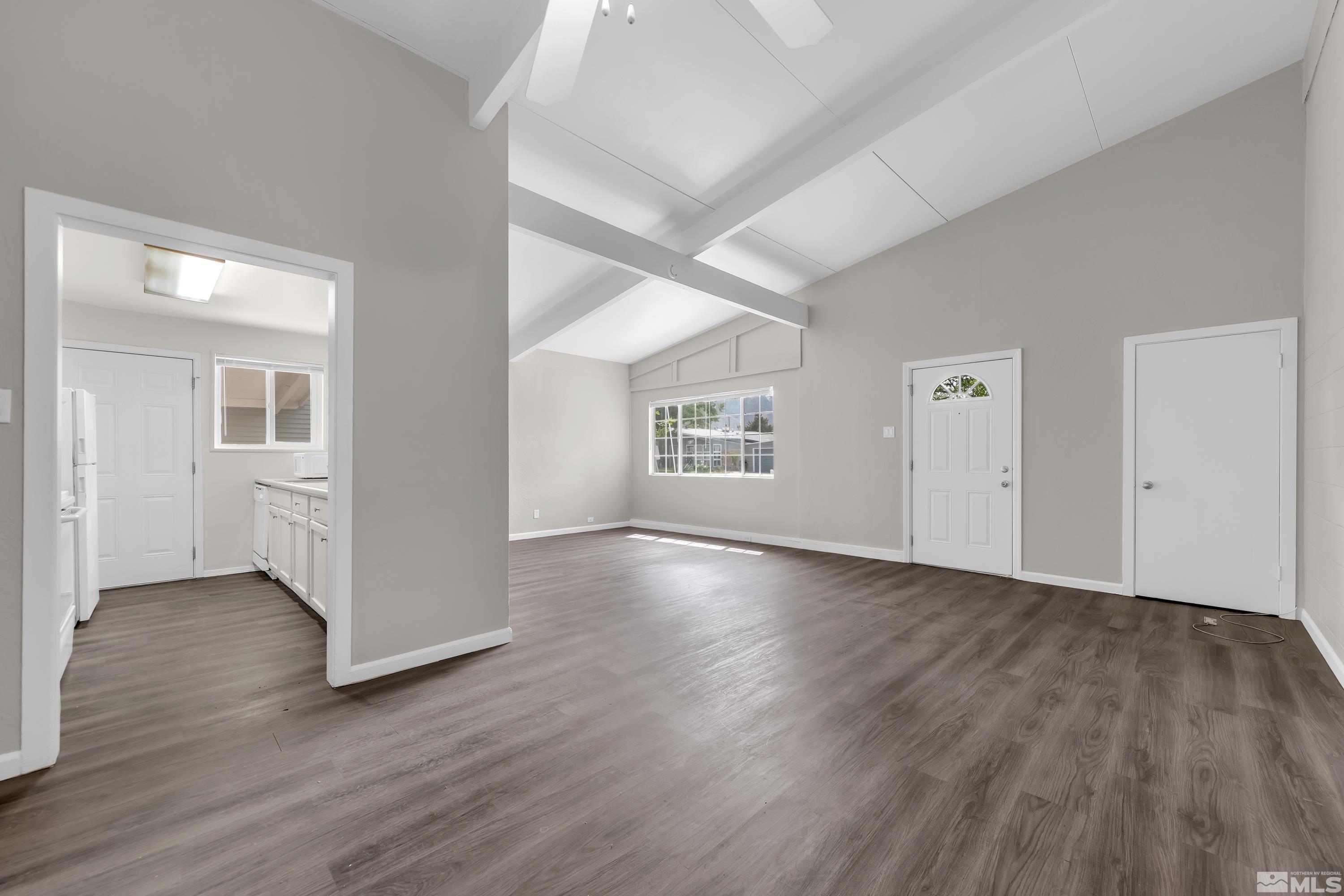 12000 Rocky Mountain Street Reno, NV 89506 - Photo 7 of 40 an empty room with wooden floor and windows